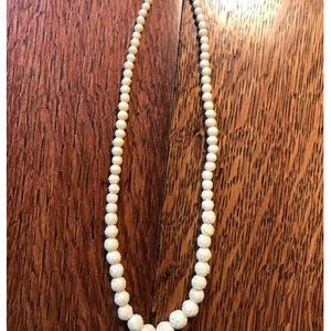 Vintage Carved Celluloid necklace. Has screw in clasp.